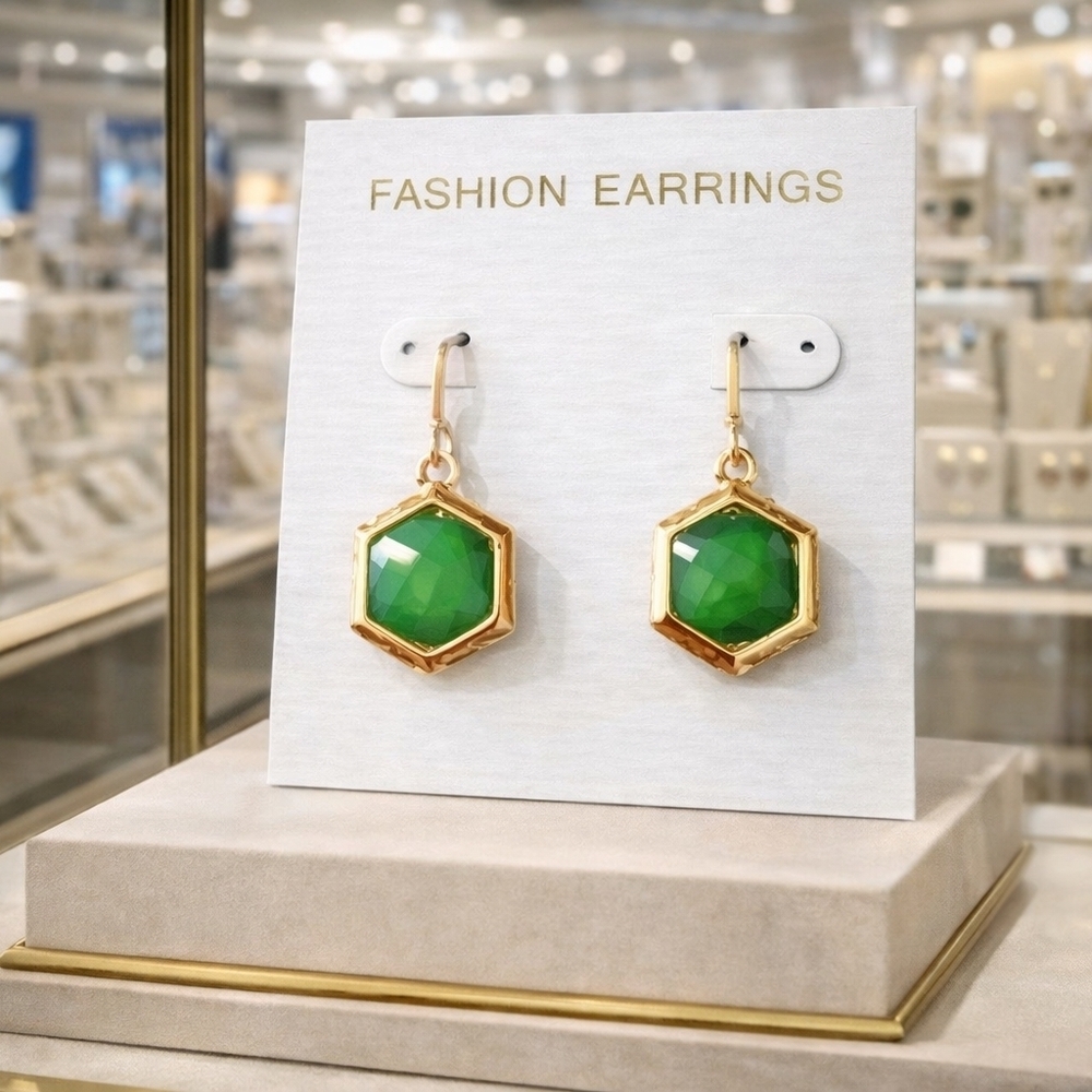 Women's gold earrings with green stone